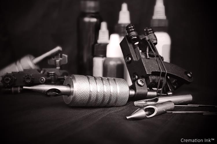 Open Cremation Ink ® cremation ashes tattoo ink bottle on a tattoo artist's work surface
